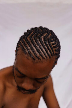Man with Cornrows