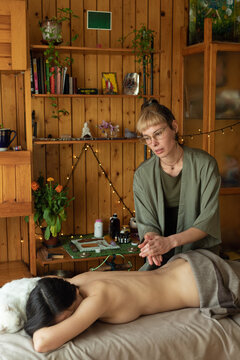 woman rubbing oil on her hands