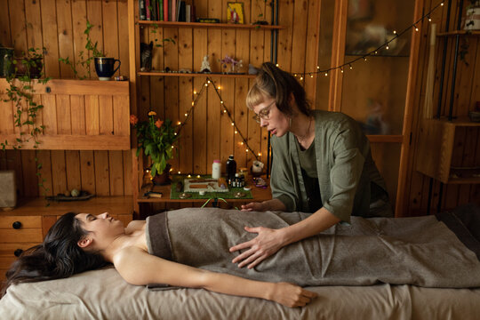 Thai pelvic massage through fabric
