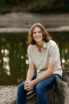 Smiling Teen Boy Poses for Photo Outdoors