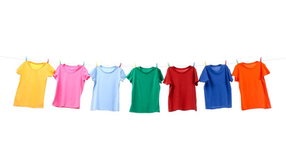 Colorful t-shirts drying on washing line isolated on white