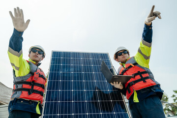 Workers Technicians are working to construct solar panels system on construction site. engineers...