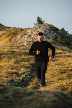 Man running on the mountain trail