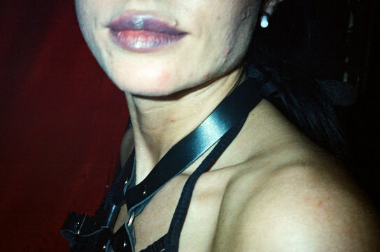 Anonymous girl on a party with purple lips 