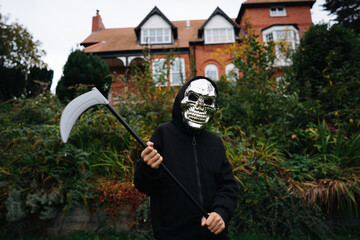 Kid dressed as a death for halloween