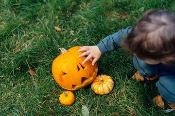 Pumpkin and boy during Halloween