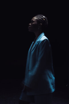 a bright girl on a dark background 