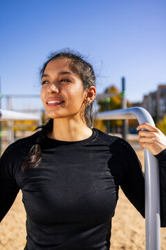 smiling female athlete during active training
