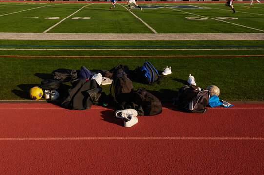 Football (soccer) game. Staff bags on the field