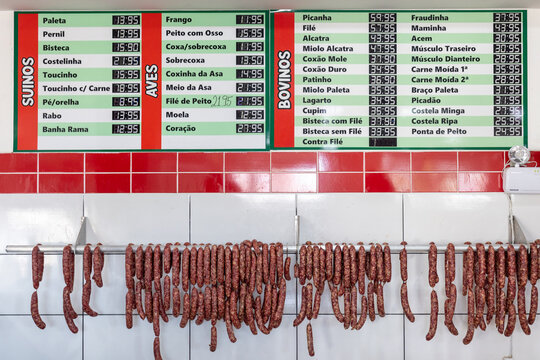 Price board displaying prices of cuts of meat at small family butchery