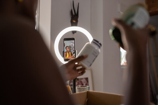 Crop black female blogger shooting commercial