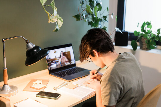 Tutor Teaching Kid During Remote Lesson From Home
