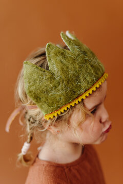 Studio portrait of girl with a wool felt crown