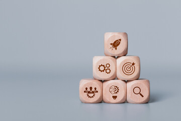 Startup business concept. Wooden blocks with business start-up icons. Strategic planning and...