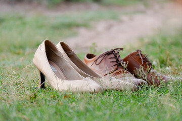 Men's and women's shoes  on the lawn