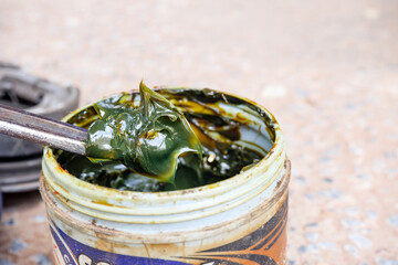 Green type grease in a jar