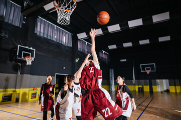 Basketball team playing in gym