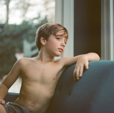 Young boy sitting in a chair