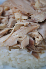 Boiled chicken, steamed rice, pink plate.
