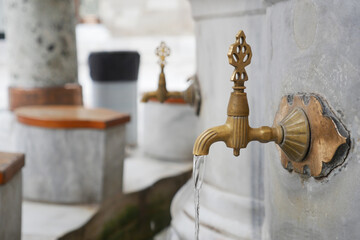 water pouring from a faucet tap outdoor in istanbul 
