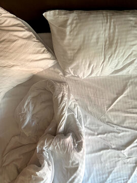 Empty crumpled fabric on bed