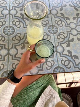 Crop woman with cocktail