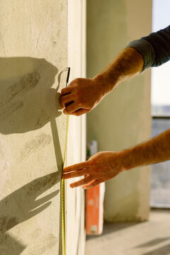 Engineer Use Tape Measure Wall