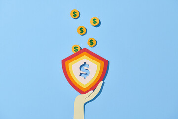 Coins and a shield with a castle.