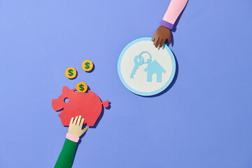 Saving to buy a house and piggy bank with coins