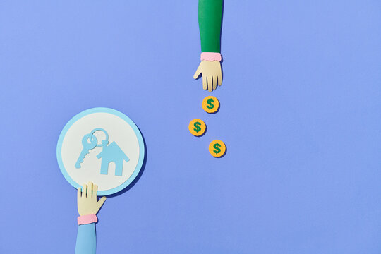 House model on human hands with coin icon.
