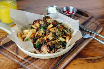 A plate of food with a fork and knife on a wooden table