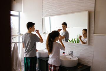 Siblings maintaining oral health healthcare routine