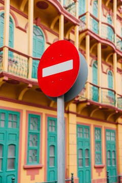No Entry sign in front of vibrant architecture
