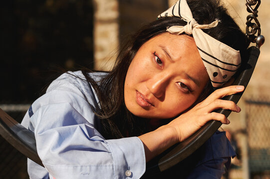 Young stylish asian woman posing in an urban city