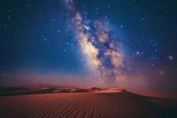 Poster A captivating landscape photograph captures the Milky Way stretching across the desert sky, adorned with countless stars, creating a breathtaking celestial panorama.      © Uliana