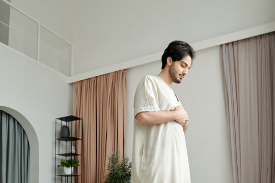 Muslim Man Praying With Hands On Chest