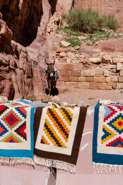 Beautiful handmade mats and donkey in Petra, Jordan