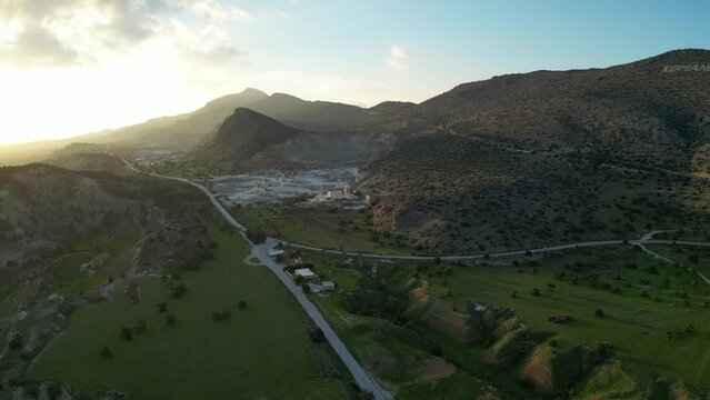 Landscape. The hills, mountains, meadows and plains of Cyprus. Komando. A road with cars. Quarry.