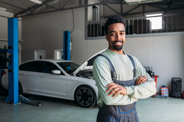 Portrait of Mechanic Standing in Car Workshop