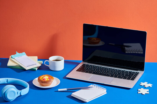 A plate of yummy custard tart on office working desk