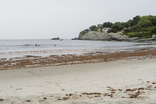 rhode island beach with a rocky cliff 