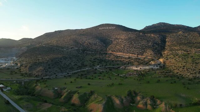Landscape. The hills, mountains, meadows and plains of Cyprus. Komando. A road with cars. Quarry.