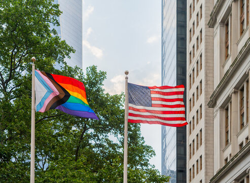 Progress Pride Flags Holding On The Street.