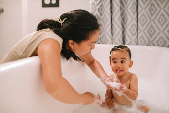 Mother Bathing Her Baby