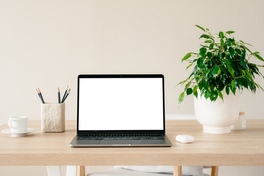 Laptop with a white screen in the home interior