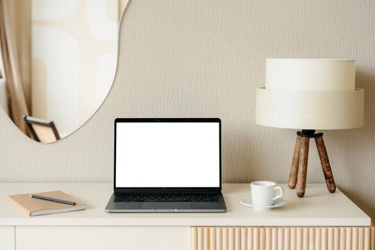 Laptop with a white screen in the home interior