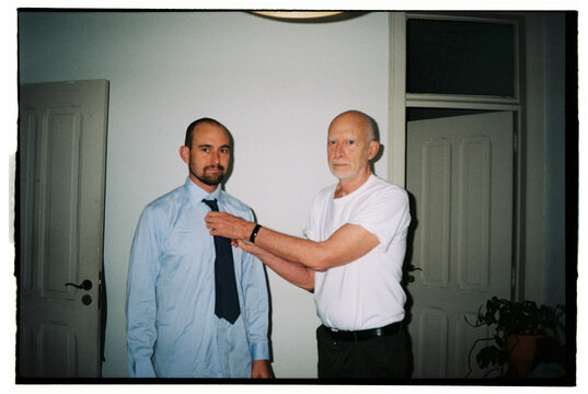 Portrait of father and son at home