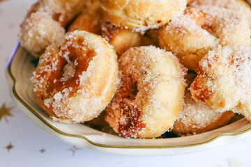 bowl of donuts with sugar