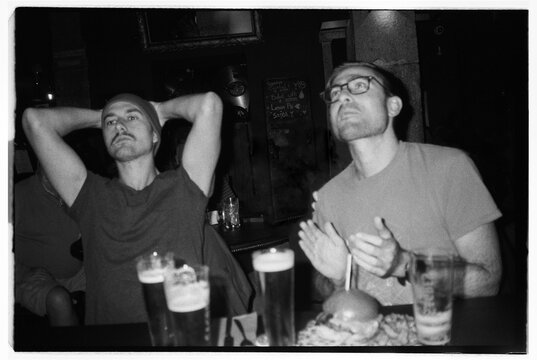 Friends at the pub watching the match