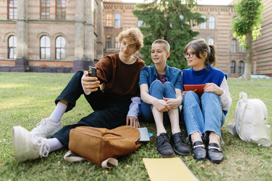 Classmate graduate friendship smartphone photographing pastime campus